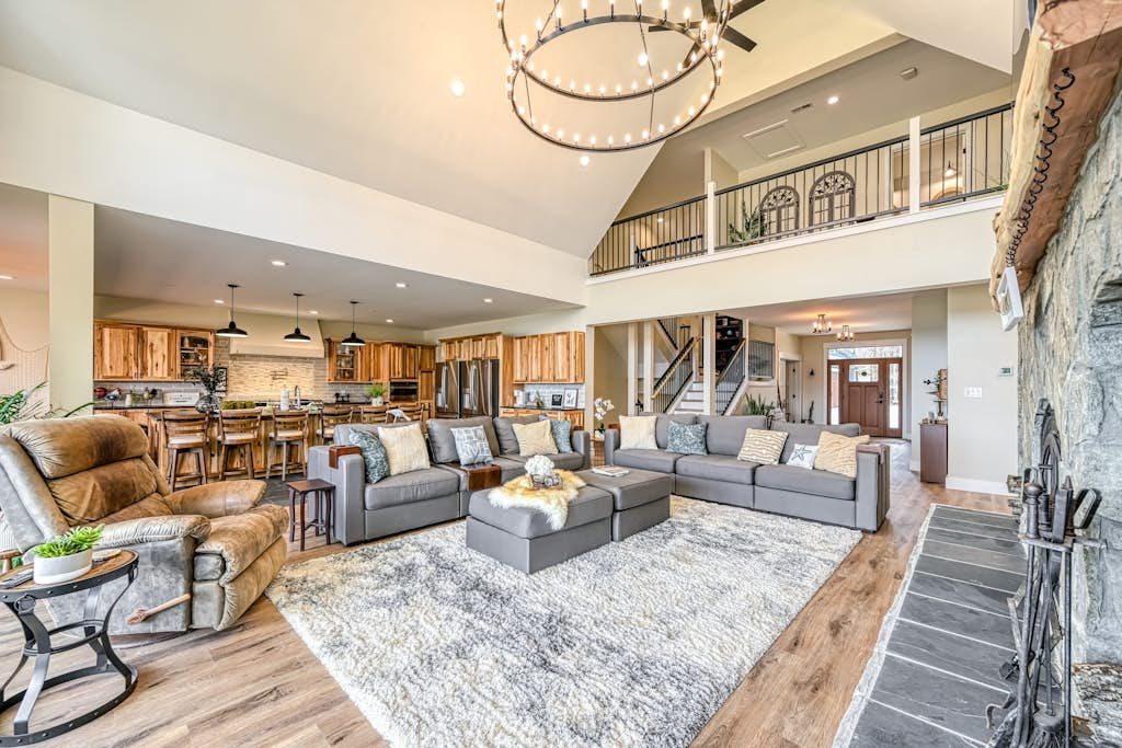 Dog-friendly lakefront home with a game room, children's items, and firepit