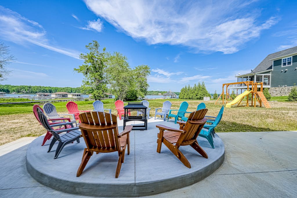 Dog-friendly lakefront home with a game room, children's items, and firepit