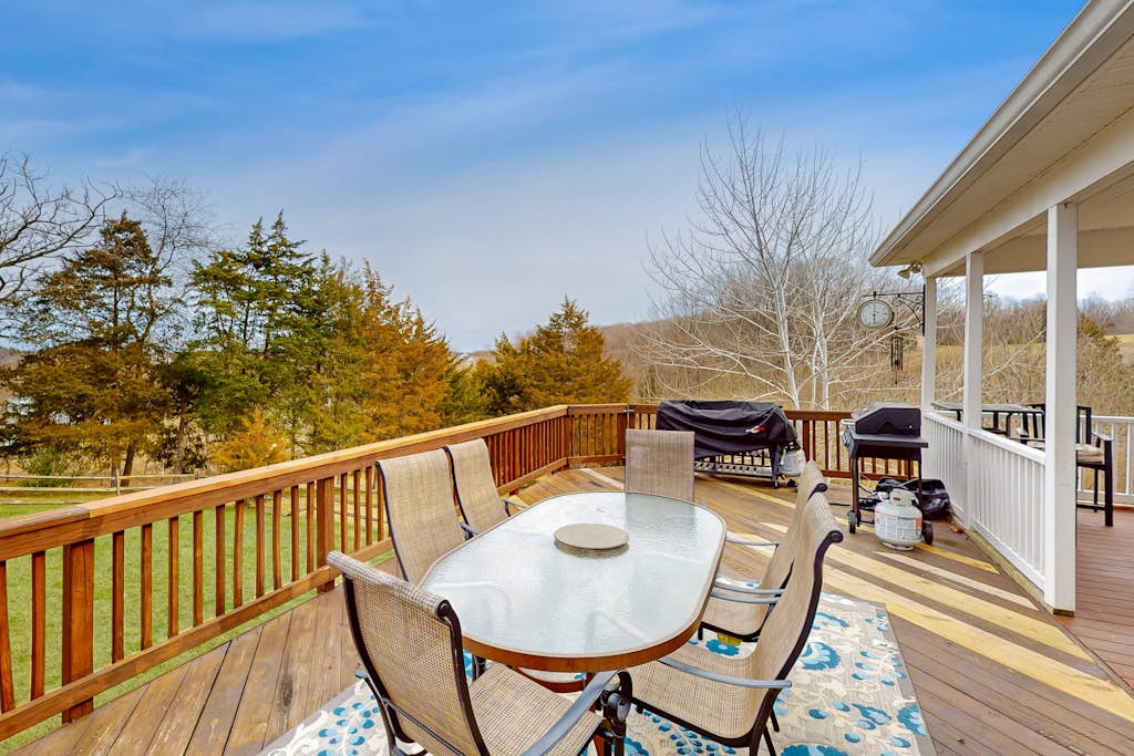 Nature lover’s lakefront home with a beach, dock, fire ring, & more