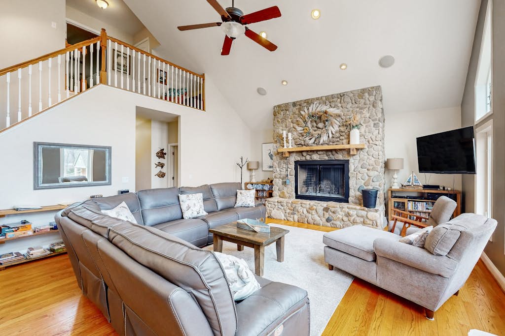 Nature lover’s lakefront home with a beach, dock, fire ring, & more