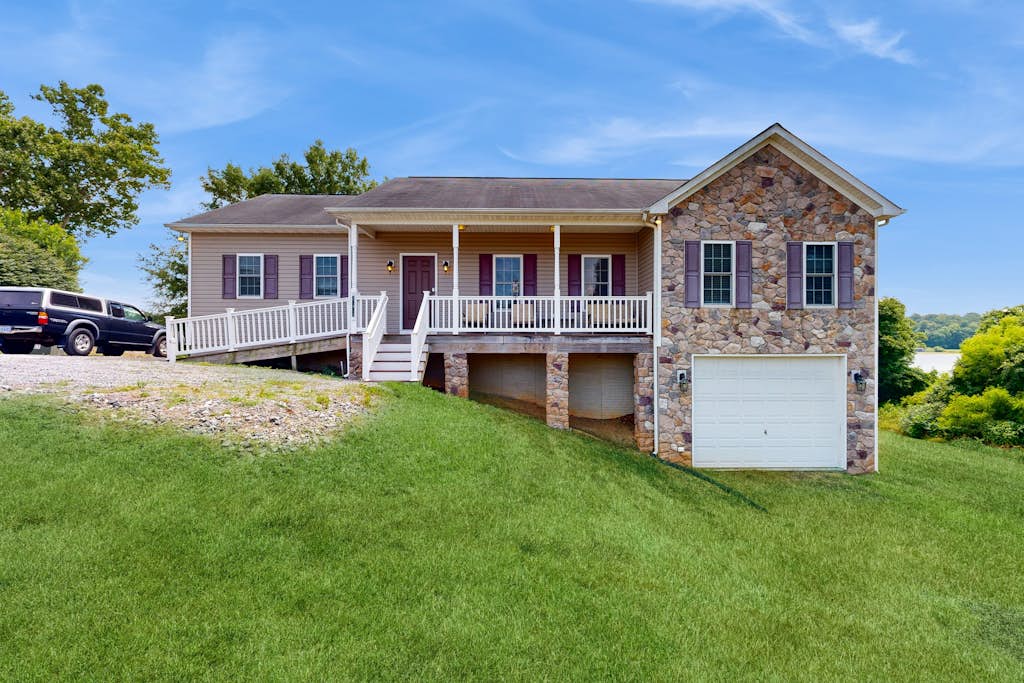 Two-story, lakefront getaway with dock, beach, grill, 2 kayaks, 2 canoes, AC