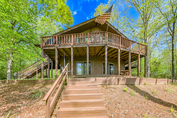Serene lakefront home with free WiFi, private dock, game room, & central AC