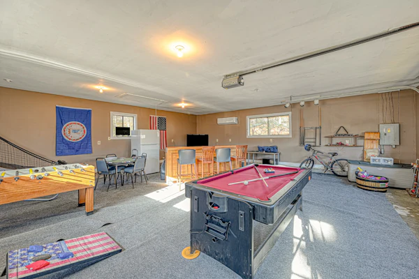 Serene lakefront home with free WiFi, private dock, game room, & central AC