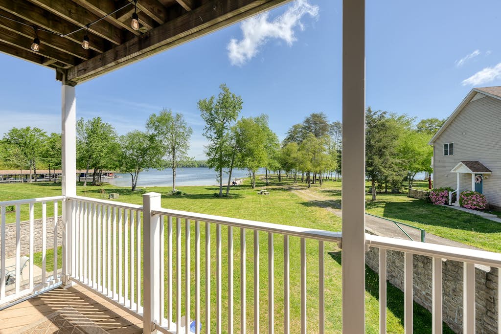 Three-story lakefront home w/ covered boat slip, and tennis/pickleball access