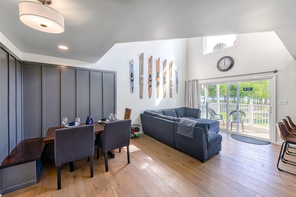 Three-story lakefront home w/ covered boat slip, and tennis/pickleball access