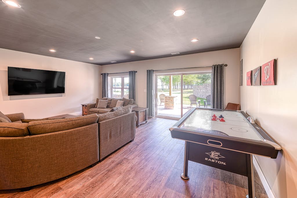 Three-story lakefront home w/ covered boat slip, and tennis/pickleball access