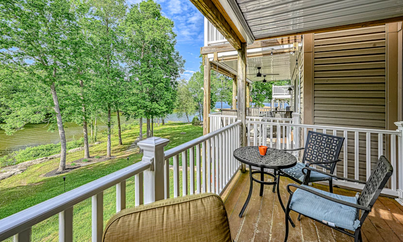 Lakefront home with kayaks, private patio, air hockey, grill, & balcony
