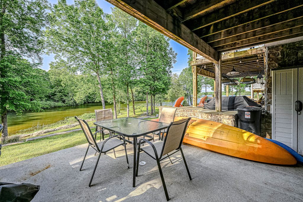 Lakefront home with kayaks, private patio, air hockey, grill, & balcony