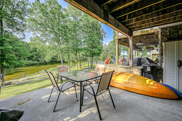 Lakefront home with kayaks, private patio, air hockey, grill, & balcony