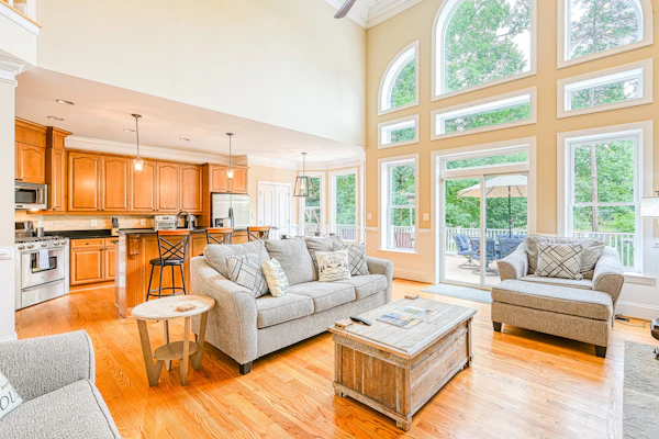 Lakefront home with private beach, dock, deck, kayaks, game room, & fireplace