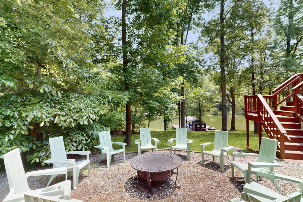 Spacious waterfront escape with screened porch, water slide, kayak, & games