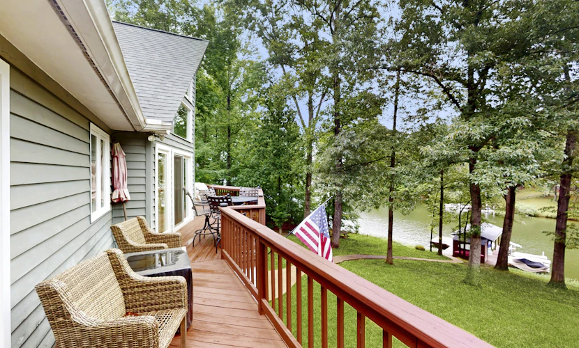 Spacious waterfront escape with screened porch, water slide, kayak, & games