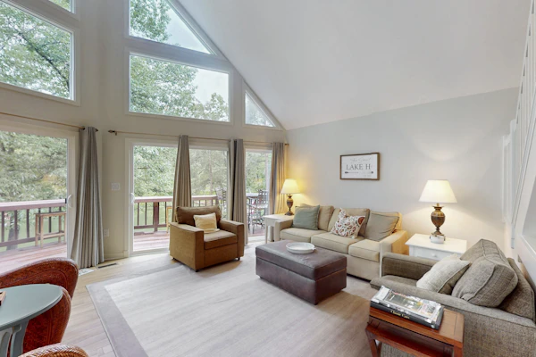 Spacious waterfront escape with screened porch, water slide, kayak, & games