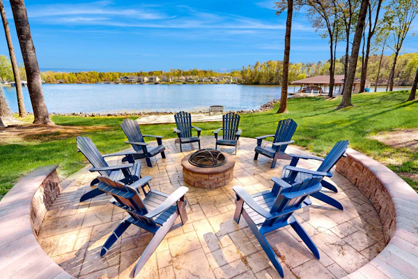 Lakefront home with private dock, kayaks, beach, badminton, firepit, & deck