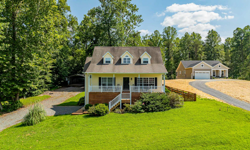 Lakeview escape near beach with fenced dog run, porch & dock with one boat slip