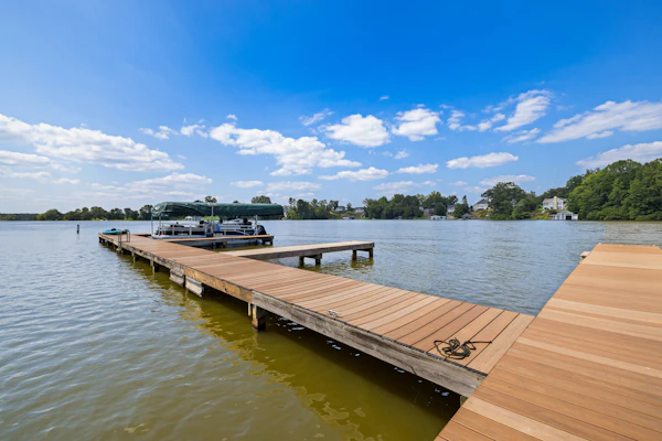 Lakeview escape near beach with fenced dog run, porch & dock with one boat slip