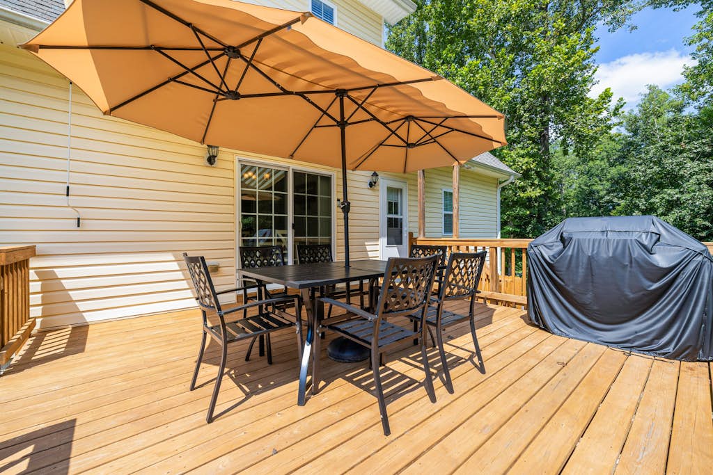 Lakeview escape near beach with fenced dog run, porch & dock with one boat slip