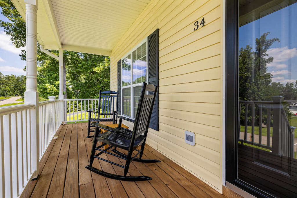 Lakeview escape near beach with fenced dog run, porch & dock with one boat slip