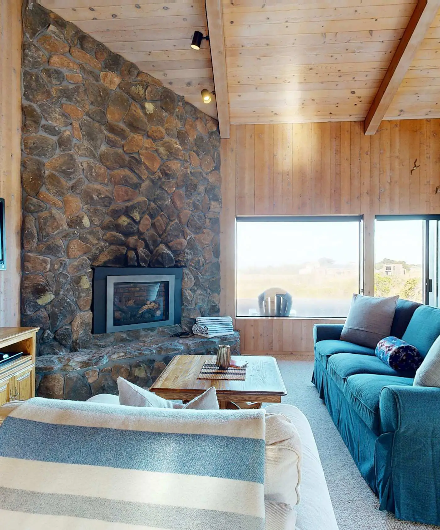 Ocean view home with stone fireplace, dog-friendly