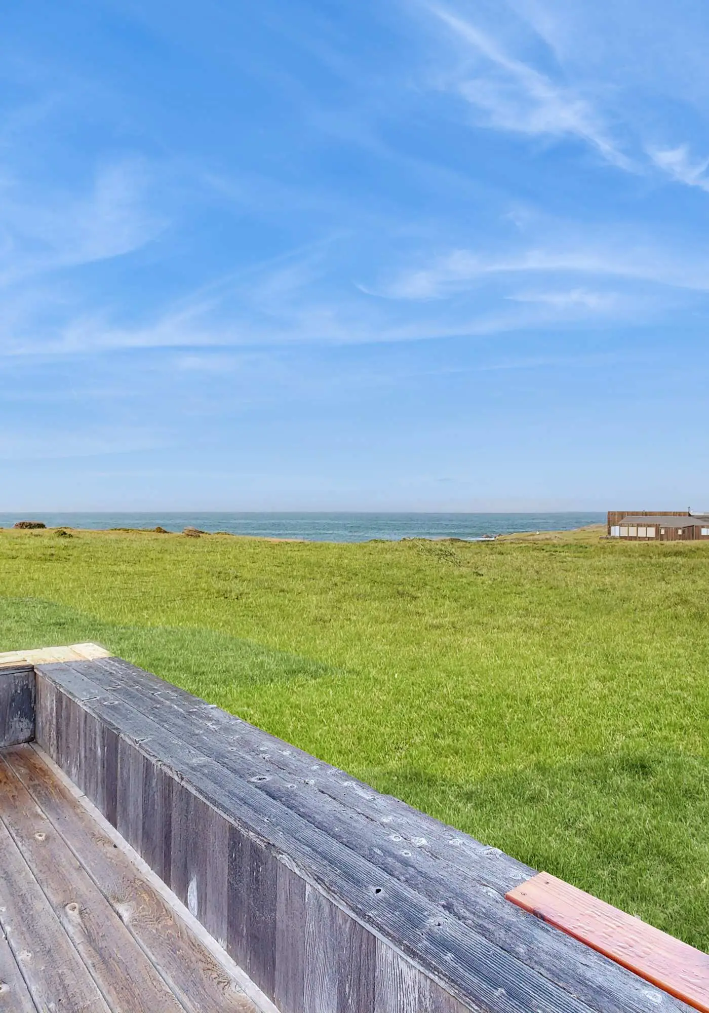 Ocean view home with stone fireplace, dog-friendly