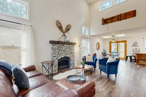 Riverfront retreat with panoramic river and forest views