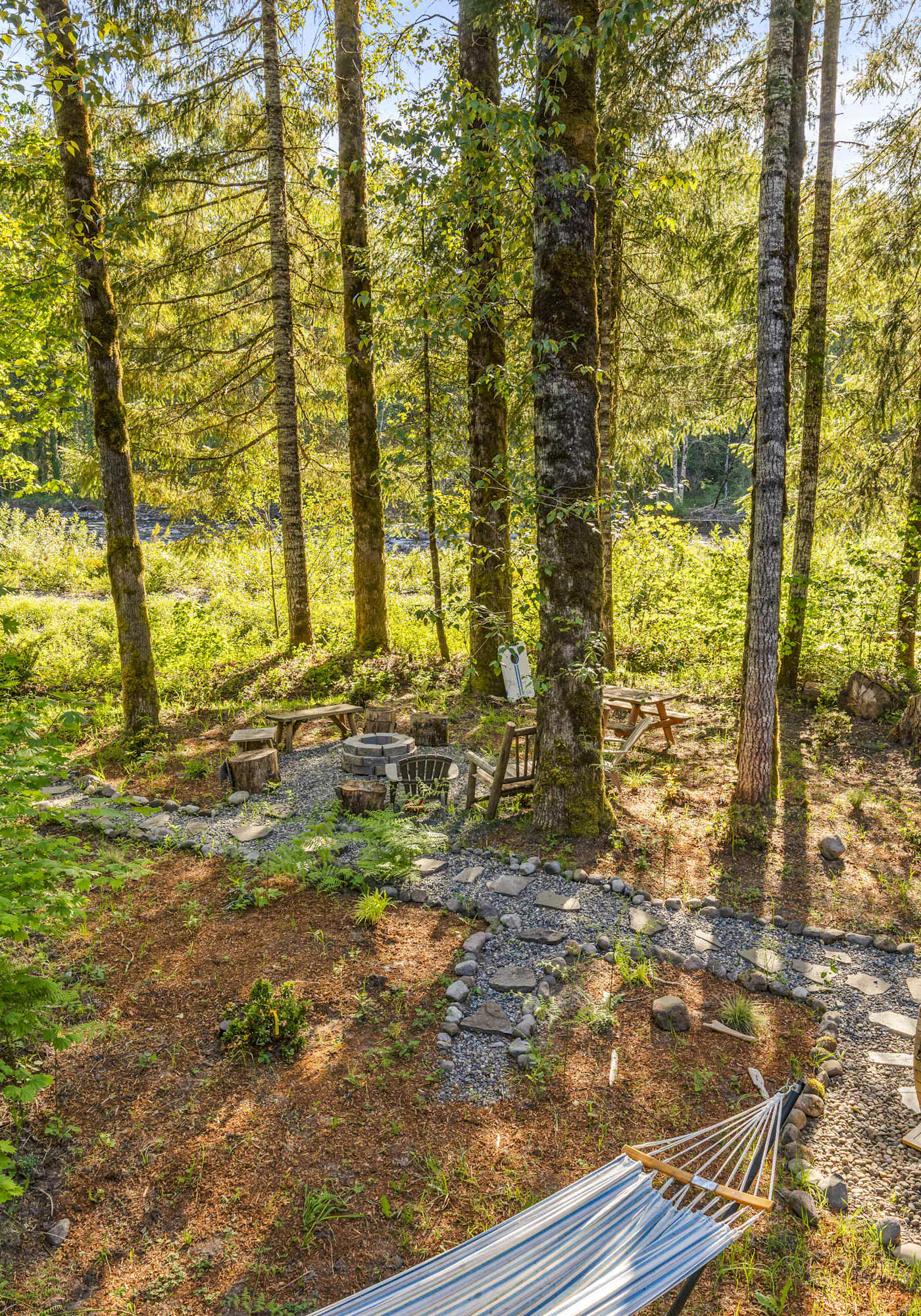 Riverfront retreat with panoramic river and forest views