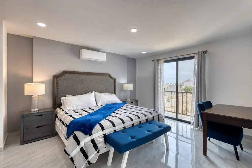 Dog-friendly hotel suite with ocean-view rooftop infinity pool, central AC & gym