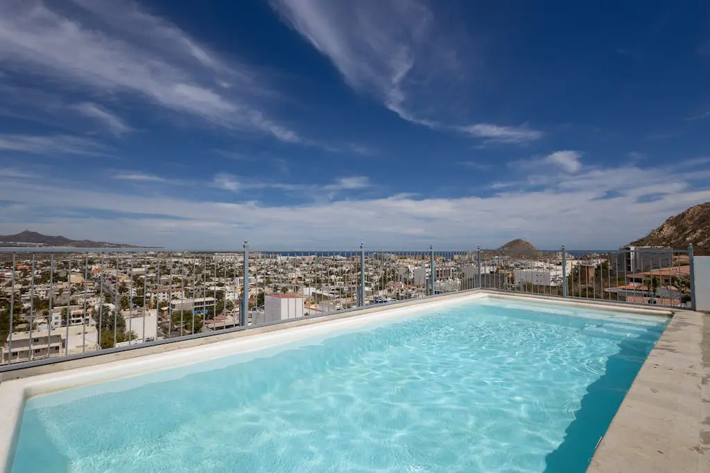 Dog-friendly hotel suite with ocean-view rooftop infinity pool, central AC & gym