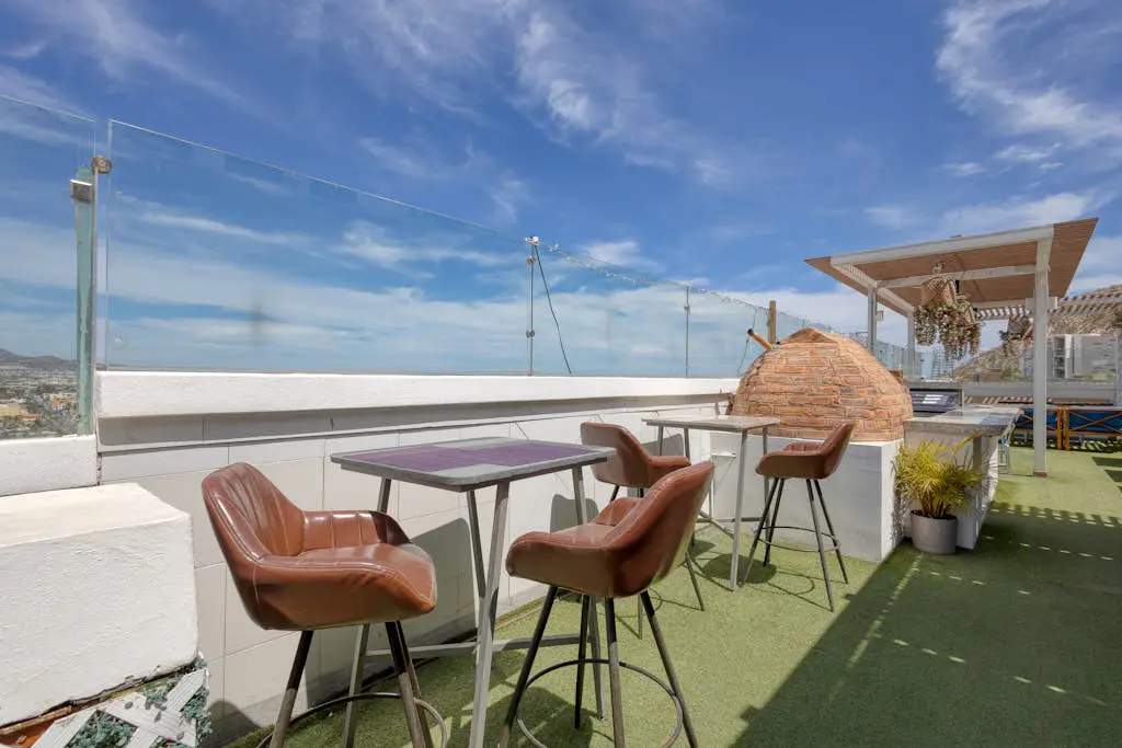 Dog-friendly hotel suite with ocean-view rooftop infinity pool, central AC & gym