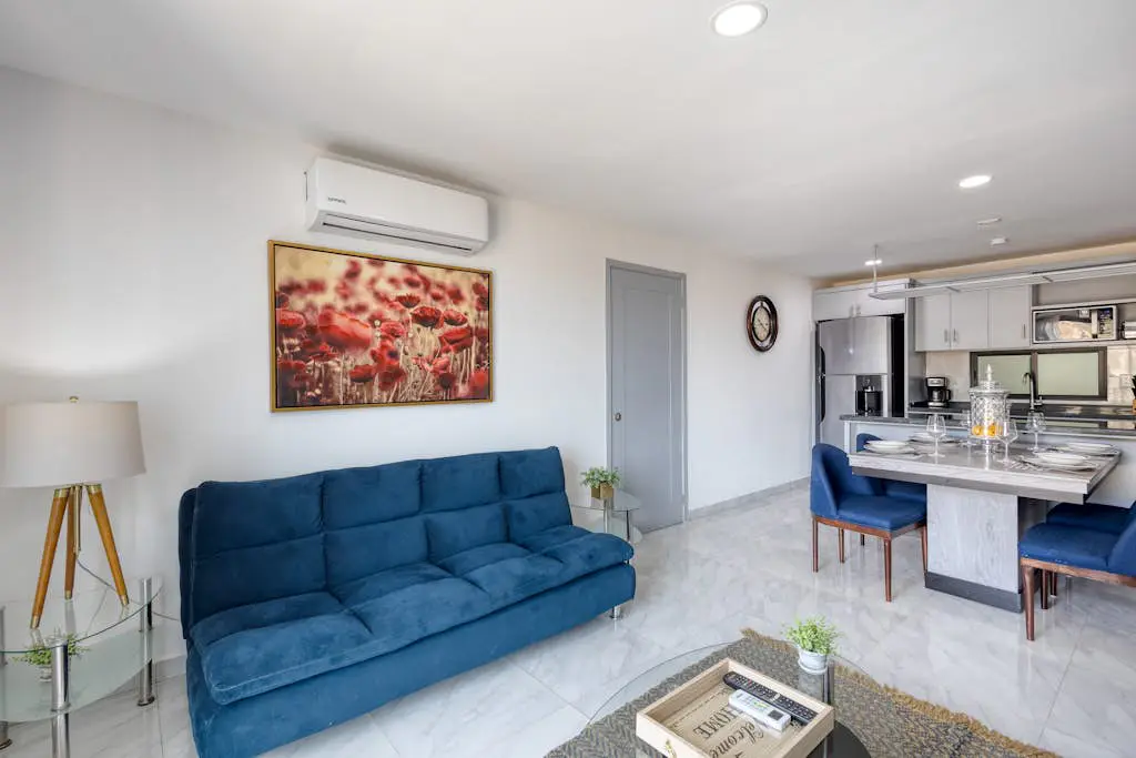 Dog-friendly hotel suite with ocean-view rooftop infinity pool, central AC & gym