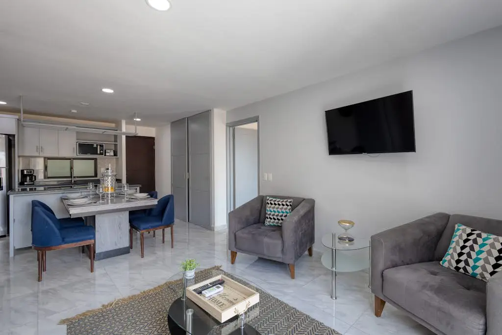 Dog-friendly hotel suite with ocean-view rooftop infinity pool, central AC & gym