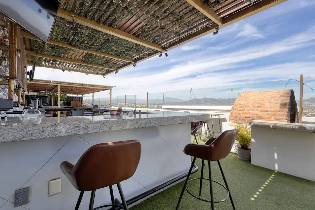 Dog-friendly hotel suite with ocean-view rooftop infinity pool, central AC & gym