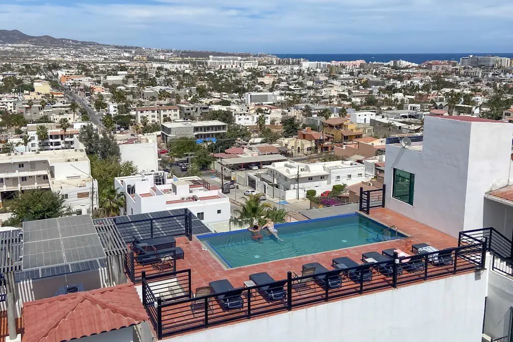 Dog-friendly hotel suite with ocean-view rooftop infinity pool, central AC & gym
