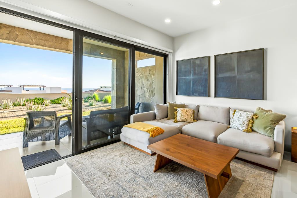 Modern apartment with. ocean view, pool, patio, tennis, & gym