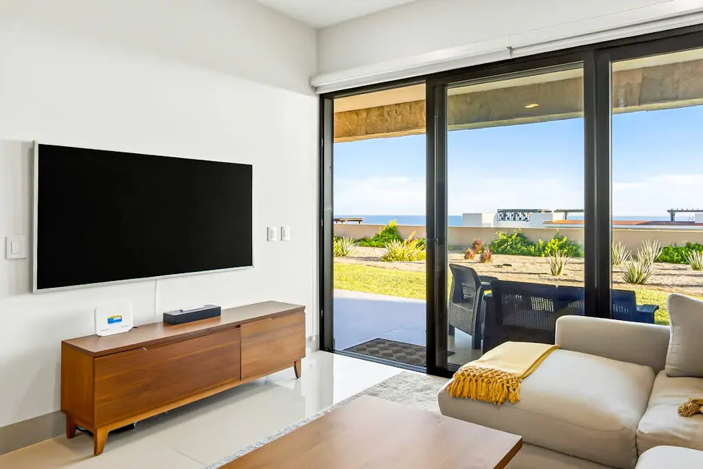 Modern apartment with. ocean view, pool, patio, tennis, & gym