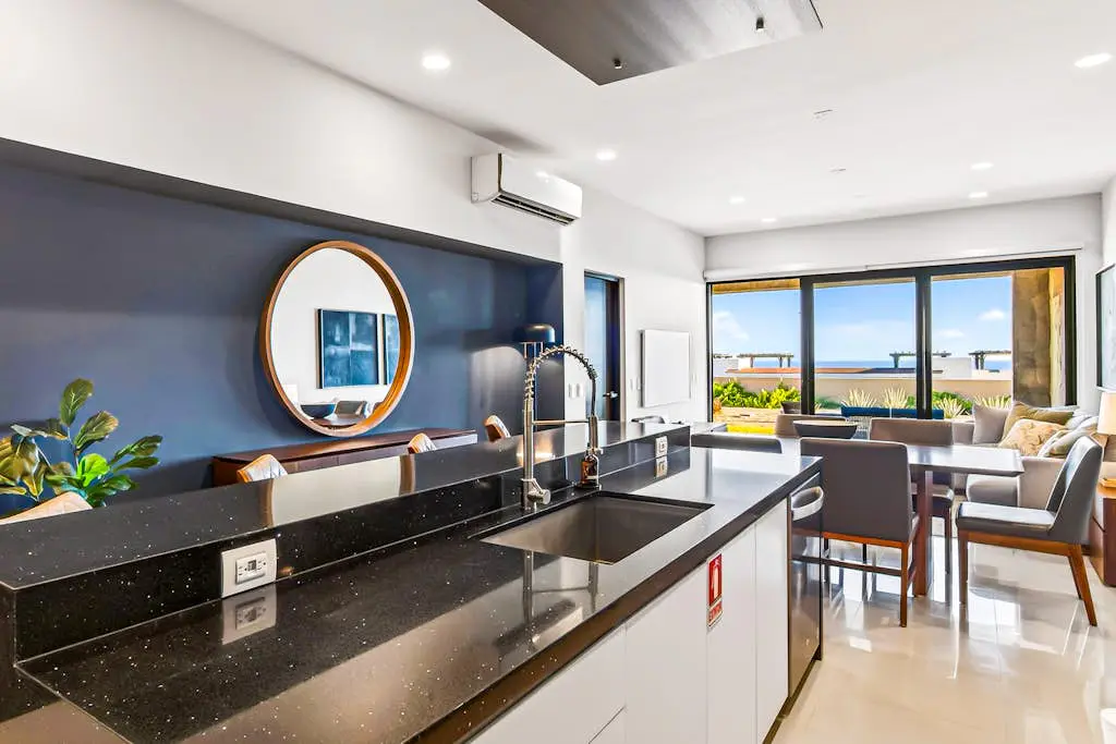Modern apartment with. ocean view, pool, patio, tennis, & gym