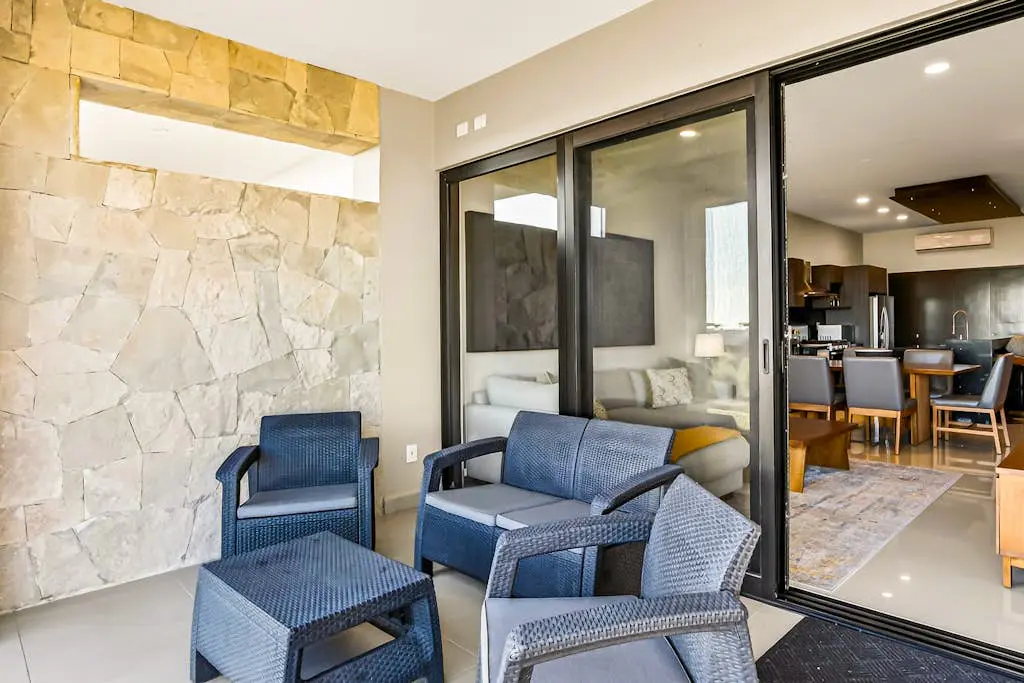 Modern apartment with. ocean view, pool, patio, tennis, & gym
