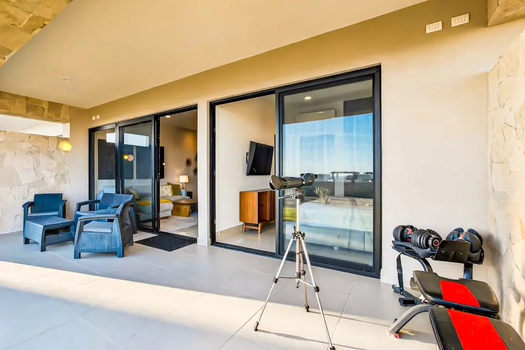 Modern apartment with. ocean view, pool, patio, tennis, & gym