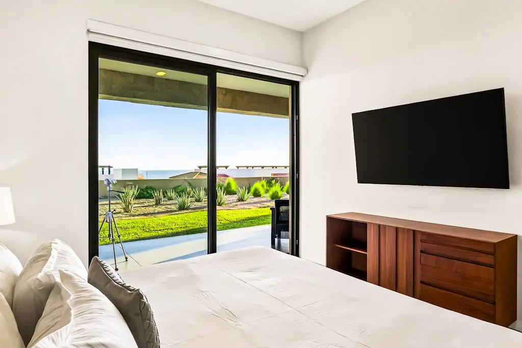 Modern apartment with. ocean view, pool, patio, tennis, & gym