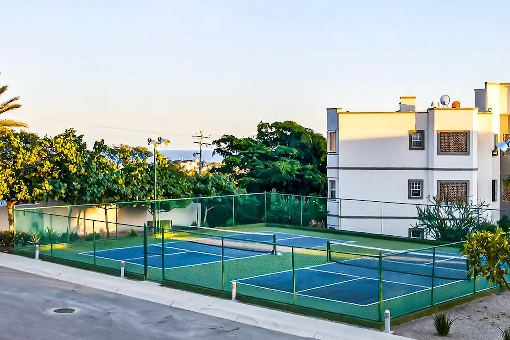 Modern apartment with. ocean view, pool, patio, tennis, & gym