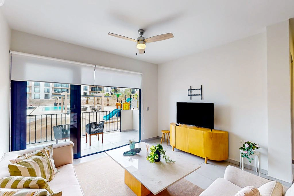 Gorgeous dog-friendly apartment with balcony, open layout, heated pool, & AC