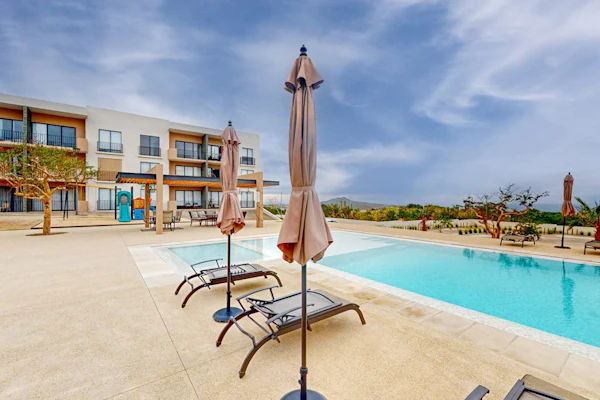 Gorgeous dog-friendly apartment with balcony, open layout, heated pool, & AC