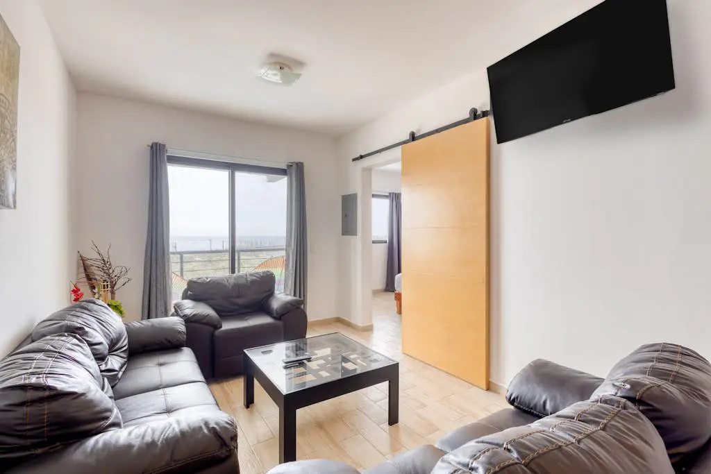 Ocean view condo with scenic balcony, well-equipped kitchen, internet, & W/D