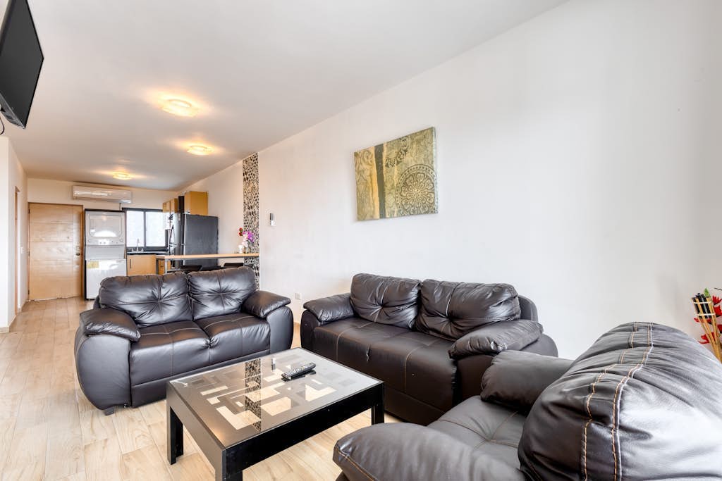 Ocean view condo with scenic balcony, well-equipped kitchen, internet, & W/D