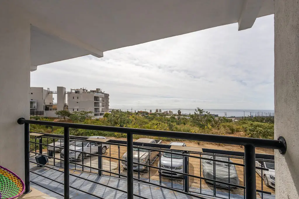 Ocean view condo with scenic balcony, well-equipped kitchen, internet, & W/D