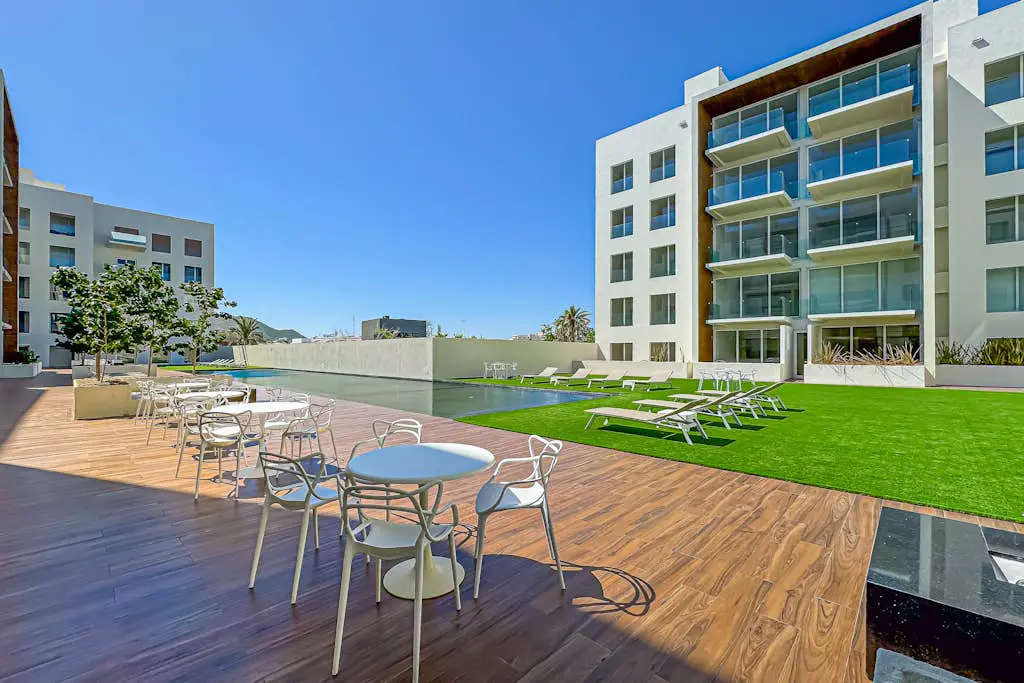Luxury condo with shared gym, rooftop pool, and centrally located