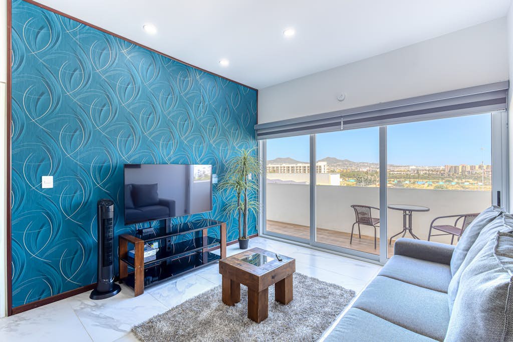 Luxury condo with shared gym, rooftop pool, and centrally located