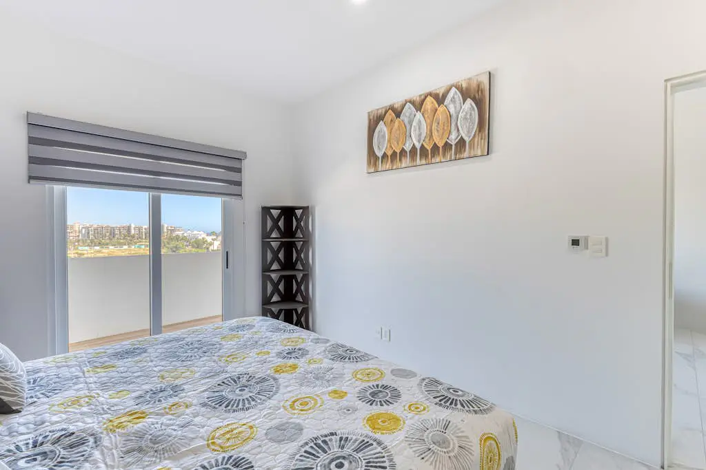 Luxury condo with shared gym, rooftop pool, and centrally located