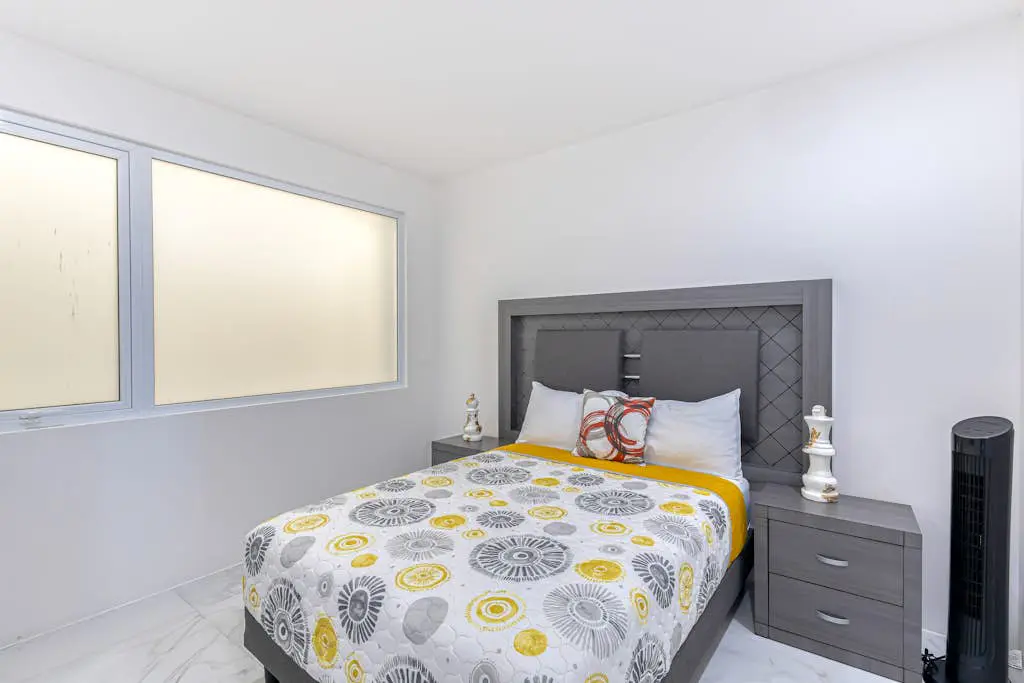 Luxury condo with shared gym, rooftop pool, and centrally located