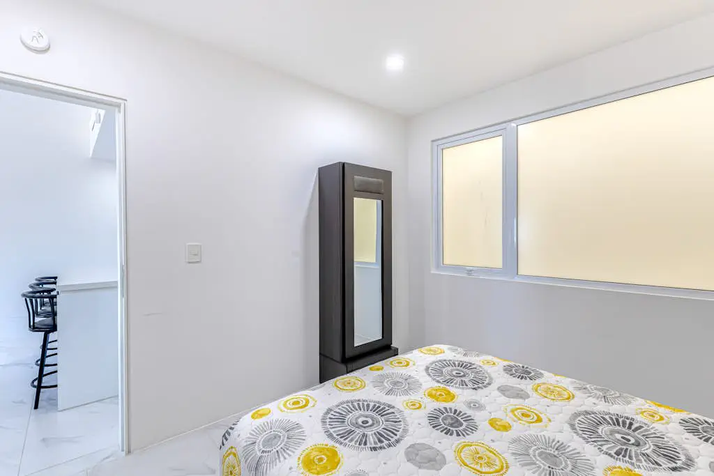 Luxury condo with shared gym, rooftop pool, and centrally located